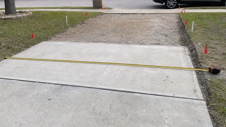 DFW driveway extension quote preparation with concrete area marked