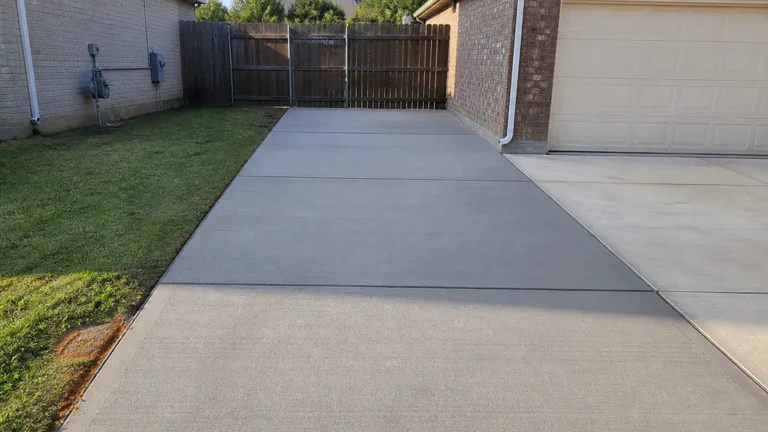 Concrete parking pad layout for a McKinney area driveway extension
