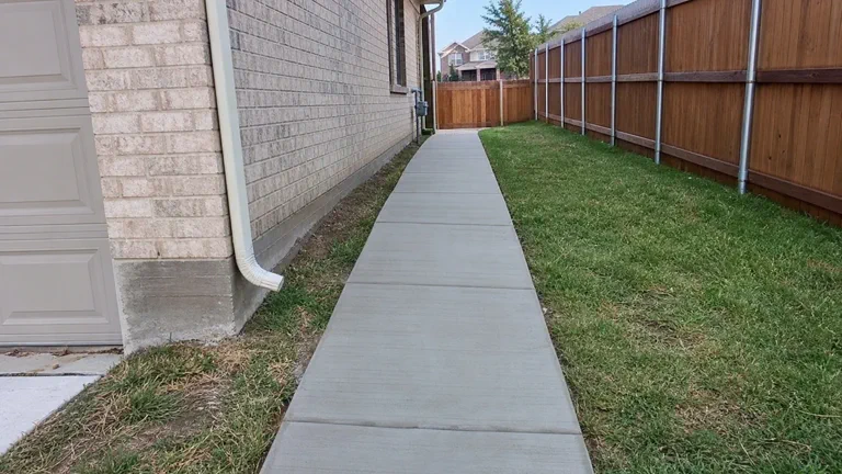 Side yard concrete walkway and added access path for an Allen area home
